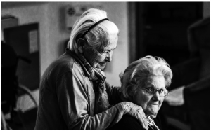 Two old ladies embracing